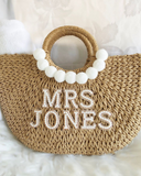 Woven Basket Bag with white Pom Poms